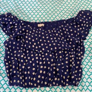 Blue sleeveless crop top with daisy’s